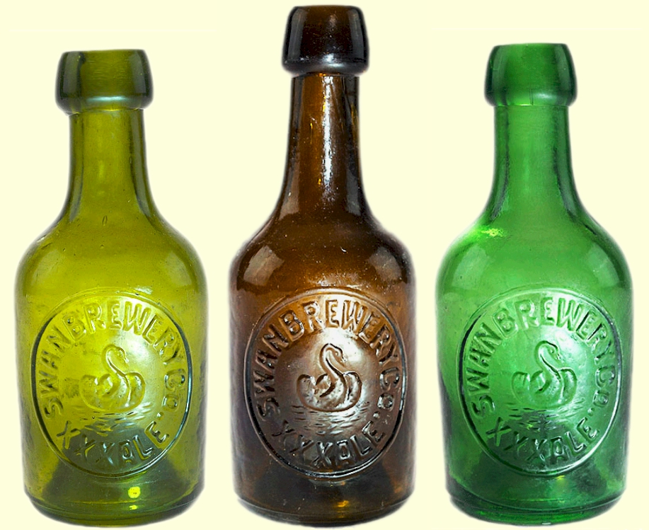 Three colors of Swan ale bottles